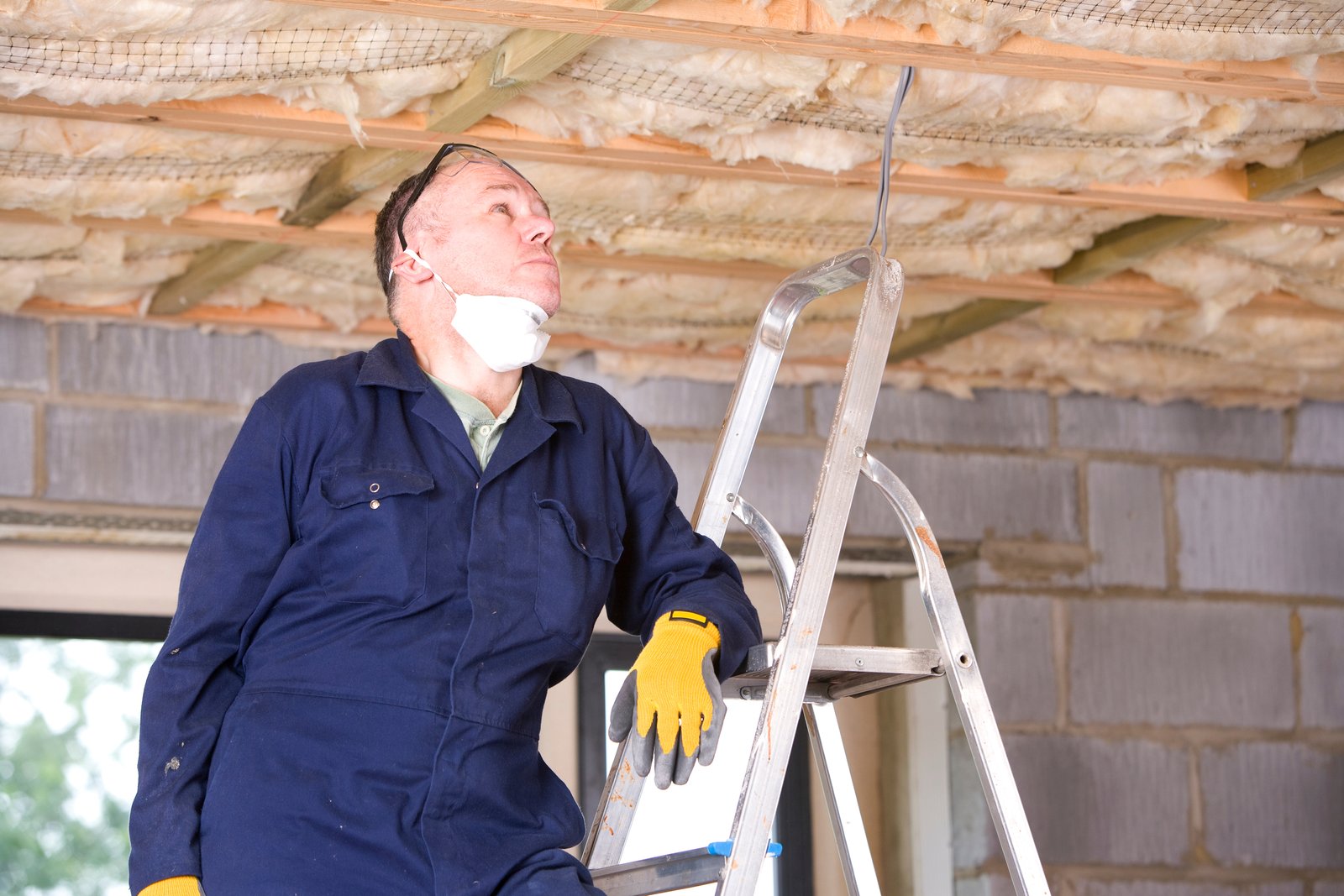 An emergency restoration responder in coveralls