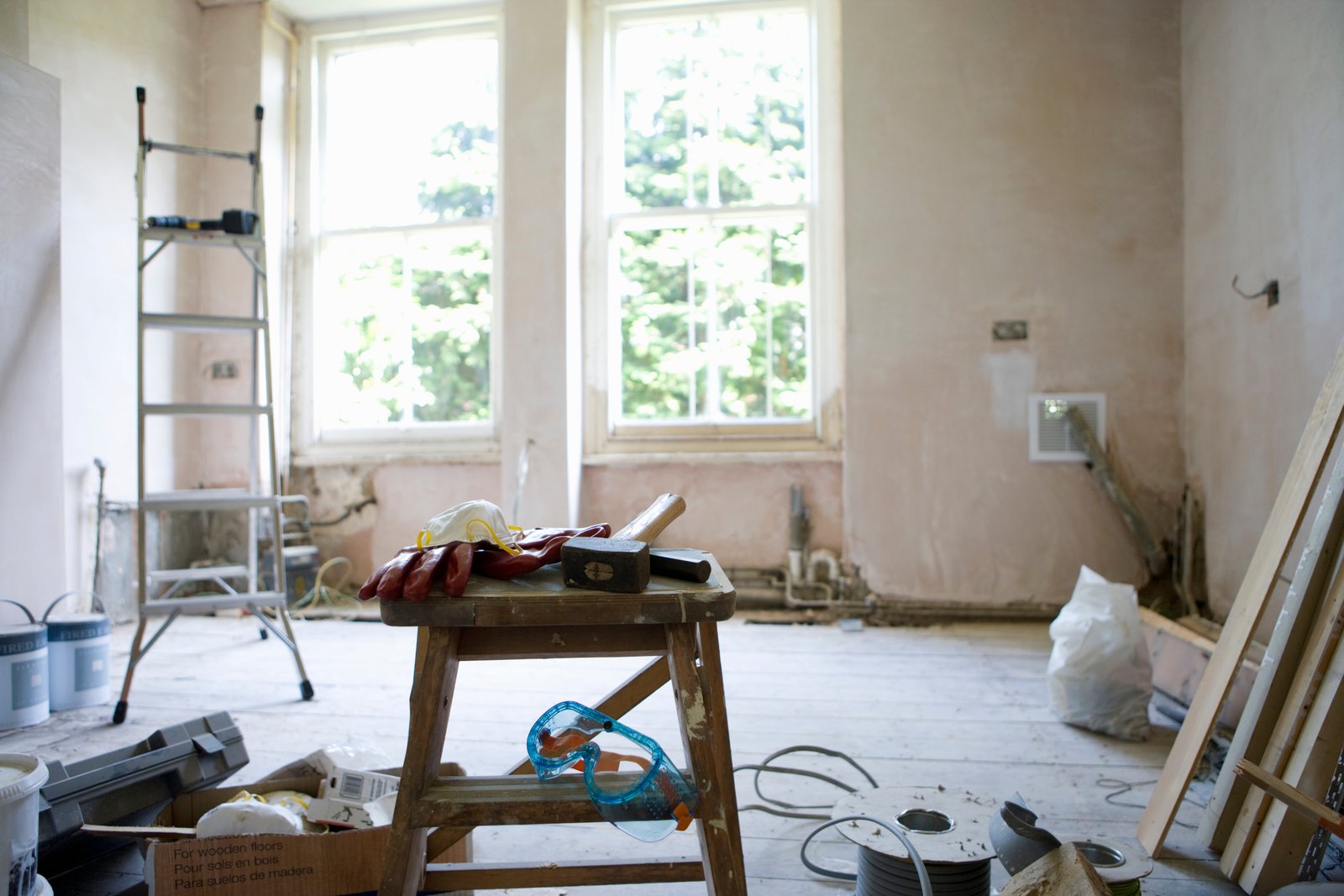 Restoration supplies arranged in an empty room during an insurance claim